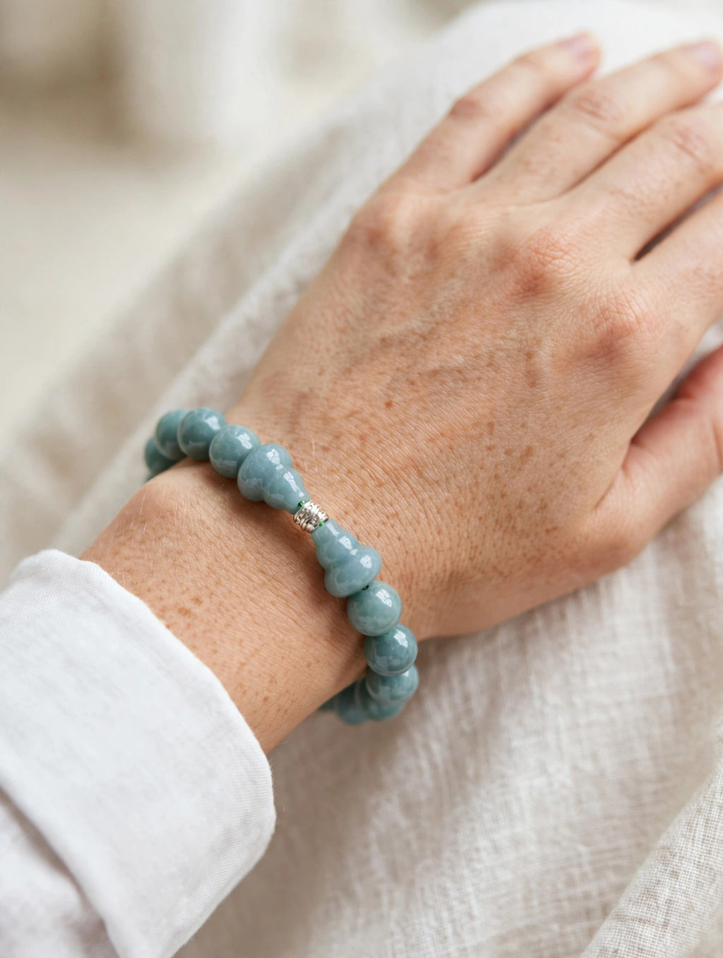 Sacred Flow: Blue Water Jade Hulu & Silver Accent Bracelet